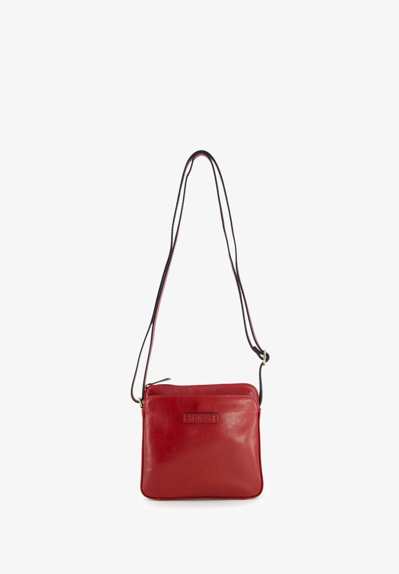 Red leather crossbody bag with adjustable black strap and zipper closure, featuring embossed "VENEZIA" logo on the front.