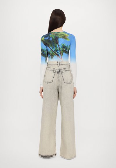 Long-sleeve top featuring blue and white gradient with palm tree print; paired with high-waisted, light gray wide-leg jeans.