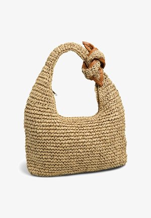 Sac à main beige tissé avec détail de poignée nouée et garniture en cuir marron, présentant un design en crochet texturé et une fermeture éclair.