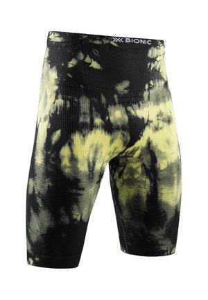 Cuissards de cyclisme ajustés tie-dye noir et jaune avec tissu texturé et ceinture de marque.