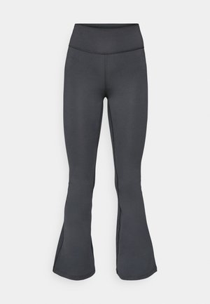 Grå leggings med en flagrende bunddesign, lavet af glat, strækbart materiale, med høj talje og sømfri konstruktion.
