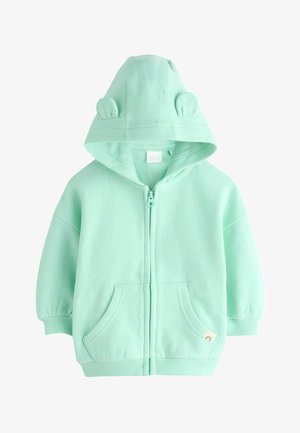 Miętowa bluza z kapturem na zamek, z kapturem z uszami misia, długimi rękawami, przednimi kieszeniami i prążkowanymi ściągaczami. Miękki bawełniany materiał o gładkiej fakturze.