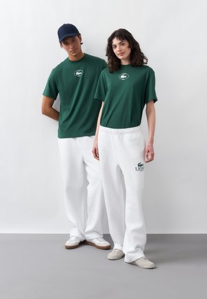 Lacoste, UNISEX - Trainingsbroek - white
