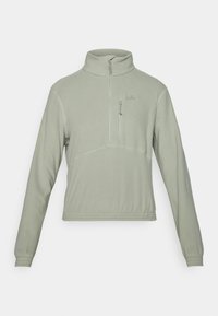 Light green fleece pullover with a half-zip collar, front zip pocket, and elasticated cuffs. Flatlock seams add detail to the design.