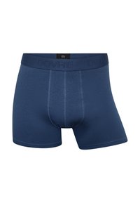 Navy blå boxershorts lavet af strækbart stof. Har en struktureret talje med logoet "DOVRE" og kontrastsyninger.