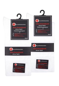 White diabetic health socks with a seamless design, no elastic band. Black labels indicate size (39/42) and features.
