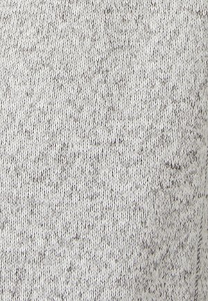 Tissu tricoté gris avec un motif chiné, présentant une texture douce et une épaisseur moyenne, adapté à une tenue décontractée.