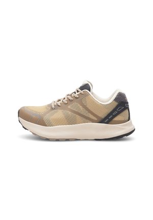 Beige athletic shoes with mesh upper, reinforced heel cap, and black accents. Features textured sole for grip and padded collar for comfort.