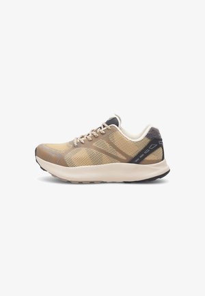 Beige athletic shoes with mesh upper, reinforced heel cap, and black accents. Features textured sole for grip and padded collar for comfort.