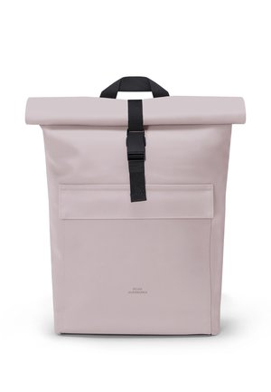 Light pink roll-top backpack with front pocket and black buckle strap, featuring a top handle for carrying.