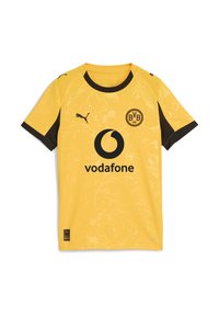 Rumena športna majica s črnimi detajli, okrašena z cvetličnim vzorcem, z logotipom Puma in blagovno znamko Vodafone na sprednji strani. Kratki rokavi.