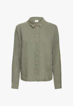 Chemise verte à manches longues avec un col à revers, une fermeture boutonnée à l'avant et des poignets retroussables. Confectionnée dans un tissu doux avec une texture subtile.