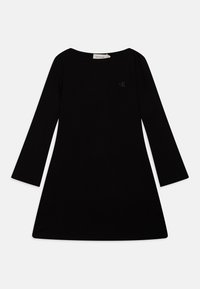 Vestido preto de manga longa com formato evazado, feito de tecido suave. Apresenta um pequeno logotipo em relevo no peito e um decote redondo.