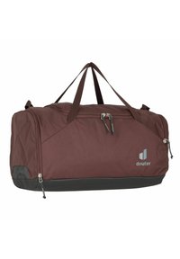 Brown fabric duffel bag with double top handles, zippered compartments, and a black bottom accent. Features a logo on the side.