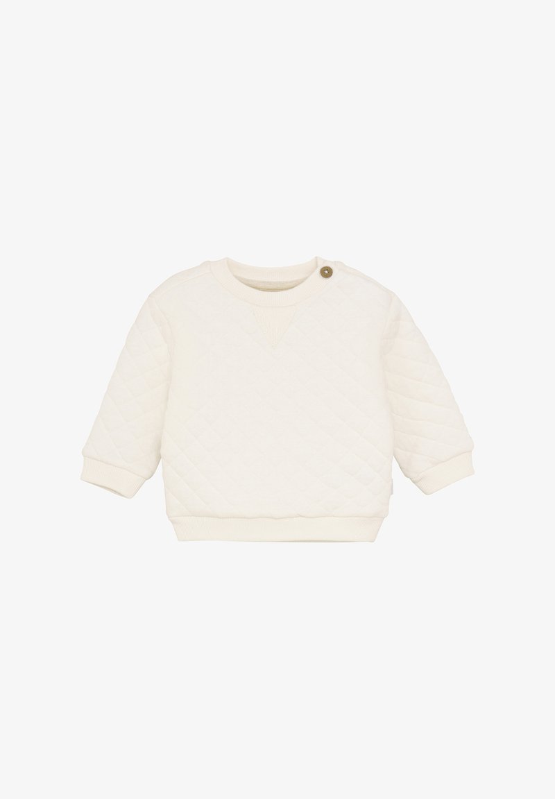 Jasnokremowy, pikowany sweter z ribbowymi mankietami i dolnym wykończeniem. Posiada okrągły dekolt oraz detal z guzikiem na ramieniu.