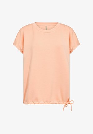 Bluza scurtă cu mâneci scurte, de culoare piersică deschisă, cu decolteu rotund și șnur ajustabil legat într-un arc la tivul din dreapta jos.