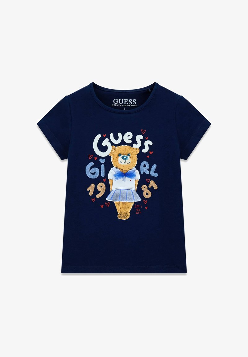 Marineblauw katoenen T-shirt met een berenafbeelding in een matrozenpak en de tekst "Guess Girl" en harten in felle kleuren.