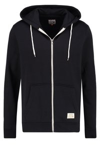 Sudadera negra con cremallera completa, cordones blancos, bolsillos canguro en la parte delantera, puños y dobladillo acanalados, y una pequeña etiqueta rectangular cerca del bolsillo.