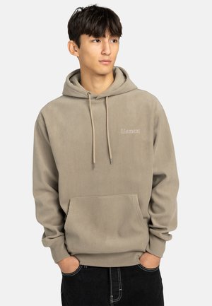 Sudadera beige de canalé con cordones, bolsillo canguro y sutil marca "Element" en el pecho. Fabricada en material suave.