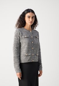 Lindex LUMI - Adīta jaka - black