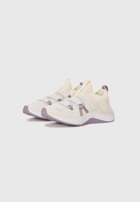 White athletic shoes with lavender accents, textured fabric upper, a high collar, and rubber sole featuring a wavy design.