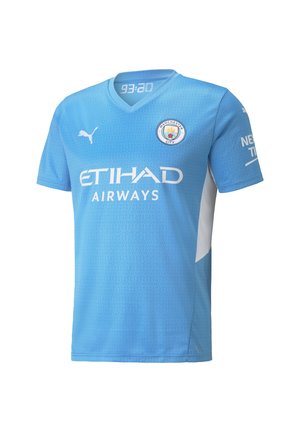 Vaaleansininen Manchester Cityn jalkapallopaita, jossa on Etihad Airwaysin logo, Puman logo ja pyöreä seuran vaakuna edessä.
