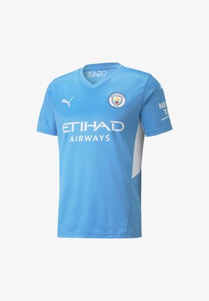 Maillot de football bleu clair de Manchester City avec le logo Etihad Airways, le logo Puma, et l'écusson rond du club sur le devant.