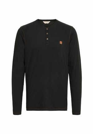 Black long-sleeve shirt with a round neckline, three-button placket, contrasting brown stitching, and a small brown logo patch on the chest.