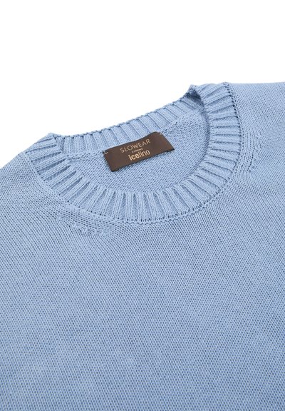 Light blue knit sweater made of soft material. Features a round neck, ribbed collar, and a label with "Slowear Icejino" stitched on it.