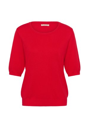 Sarkans adīts džemperis ar apaļu kakla izgriezumu, īsām pūkainām piedurknēm, ribotu apakšmalu un gludu struktūru. Bez rakstiem vai papildu akcentiem.