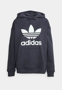 Marinblå hoodie i bomullsblandning, med en stor vit Adidas-logotyp med tre ränder och en framficka i känguru-stil. Huva med dragsko.