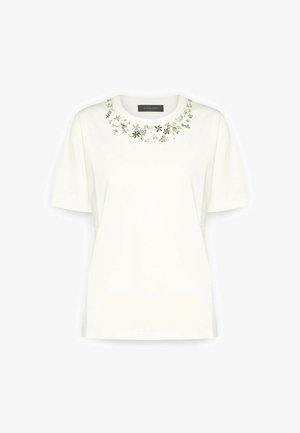 Witte korte mouwen t-shirt met bloemembroderie rond de halslijn. Gemaakt van katoen met een gladde textuur. Casual pasvorm.