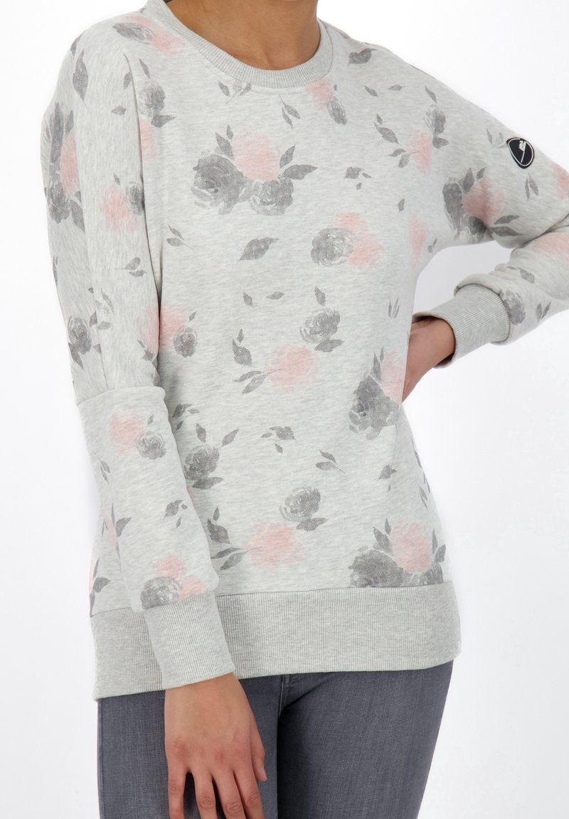 Light gray sweatshirt featuring a floral pattern in pink and gray. Ribbed cuffs and hem with a subtle logo on the sleeve. Soft fabric texture.