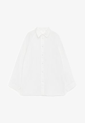 Balta ilgomis rankovėmis susegama marškinėliai su smailiu apykakliu, gulintys ant baltos fono, parodytas priekis.