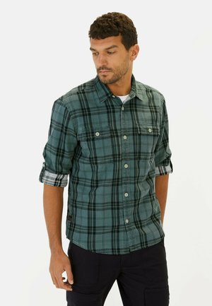 Grün und schwarz karierte Flanellhemd mit Knopfverschluss, zwei Brusttaschen und hochgekrempelten Ärmeln, aus weichem Baumwollstoff gefertigt.