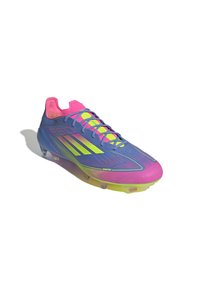 Blue and pink soccer cleat with a sleek design, featuring a textured upper, neon accents, and multiple studs on a translucent sole.