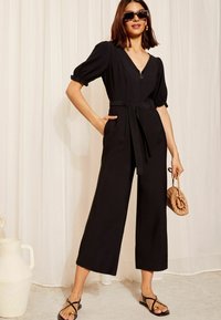 Friends Like These PUFF SLEEVE ZIP FRONT TIE WAIST - Overall / Jumpsuit - black