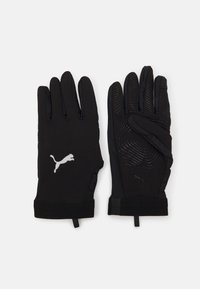 Mânuși negre cu un finisaj neted și texturat, având un logo Puma și modele în formă de val pe palmă pentru aderență. Design elegant, ajustat.