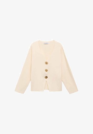 Crème lange mouwen cardigan met V-hals en drie opvallende gouden decoratieve knopen aan de voorkant.