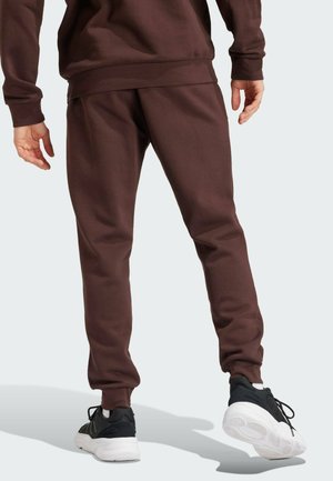 ESSENTIALS TAPERED - Tracksuit bottoms - shadow brown