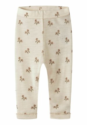 Collants à motifs en tissu crème, ornés de petits motifs floraux roses, coupe ajustée et ourlets décoratifs cousus. Texture lisse partout.