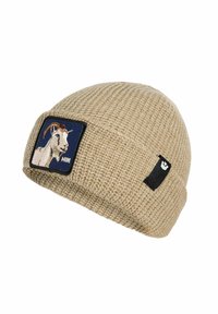 Beige knitted beanie with a folded rim, featuring a patch of a goat head and a small black rectangular tag on the side.