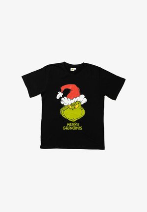 T-shirt in cotone nero con una faccia verde del Grinch, berretto di Babbo Natale rosso e il testo "MERRY GRINGIMAS" in giallo brillante.