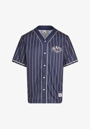 Námořnický baseballový dres s bílými vertikálními pruhy, krátkými rukávy, zapínáním na knoflíky a logem "KANI" na levém hrudníku. Vyrobeno z hladké tkaniny.