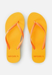 Żółte klapki plażowe z teksturowaną podeszwą i pomarańczowymi paskami. Posiadają logo "RIPCURL" w kolorze pomarańczowym na wkładce. Prostota i lekkość w designie.