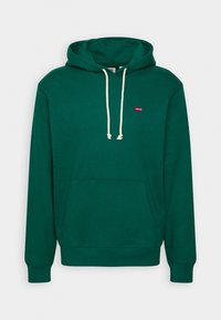 Zielona bluza z kapturem wykonana z bawełny, z przednią kieszenią, regulowanym sznurkiem i małym czerwonym logotypem Levi's na klatce piersiowej. Gładka tekstura, klasyczny krój.