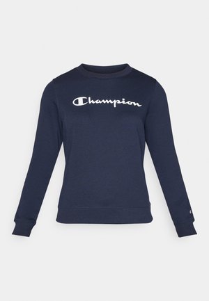 Mørkeblå hettegenser laget av bomullsmiks, med lange ermer, rund hals og en hvit "Champion"-logo sentrert på brystet.