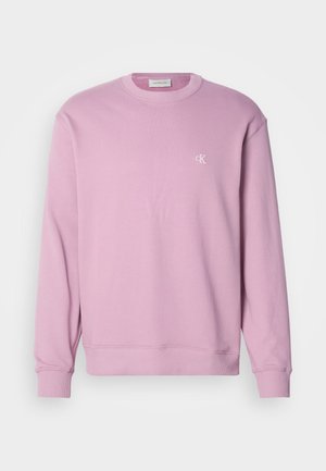Rosa Crewneck-Sweatshirt mit gerippten Bündchen und Saum, mit einem kleinen weißen Logo auf der Brust. Hergestellt aus weichem Baumwollstoff.