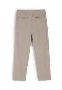 Beżowe spodnie z elastycznym pasem, z dwoma tylnymi kieszeniami i gładką teksturą. Prosty krój z nogawkami w prostym, minimalistycznym stylu.