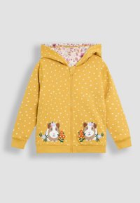 Felpa gialla con zip, decorata con un piccolo motivo floreale bianco. Presenta ricami di cavie e fiori sulla parte anteriore. Fodera in tessuto floreale.
